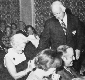 Shirley Harrison inspects the tailoring of George's newly-won Green Jacket at the Honor Award ceremony in 1969