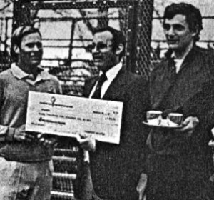 Passport Scotch's Jeff Gollin presents winning check to Steve Baird (left) and Rich Maier. Runners-up were Herb Fitz Gibbon and Hank Irvine